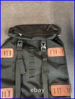 The North Face Brown Label Black Backpack with laptop sleeve. Side entry too