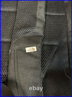 The North Face Brown Label Black Backpack with laptop sleeve. Side entry too