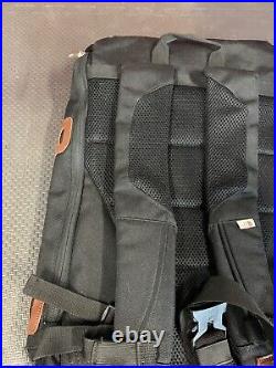 The North Face Brown Label Black Backpack with laptop sleeve. Side entry too